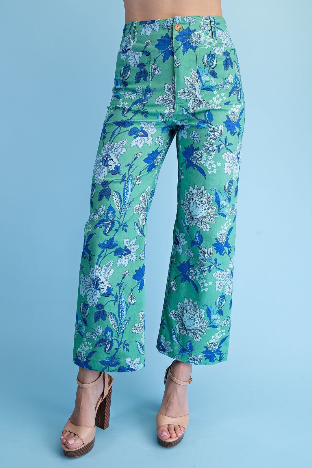 Green floral cropped pants with blue and white print