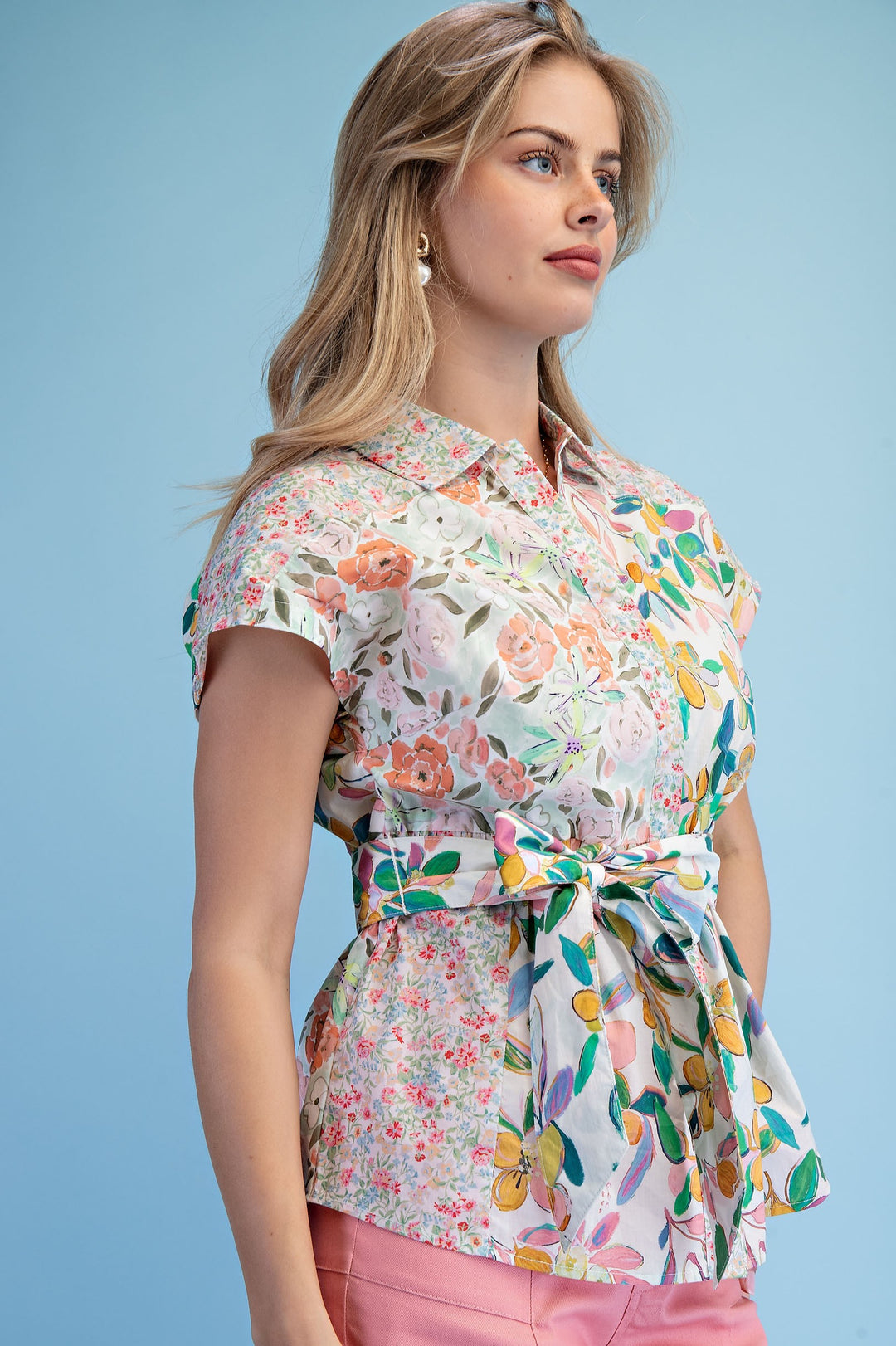 Lightweight multicolor floral blouse styled with pink pants