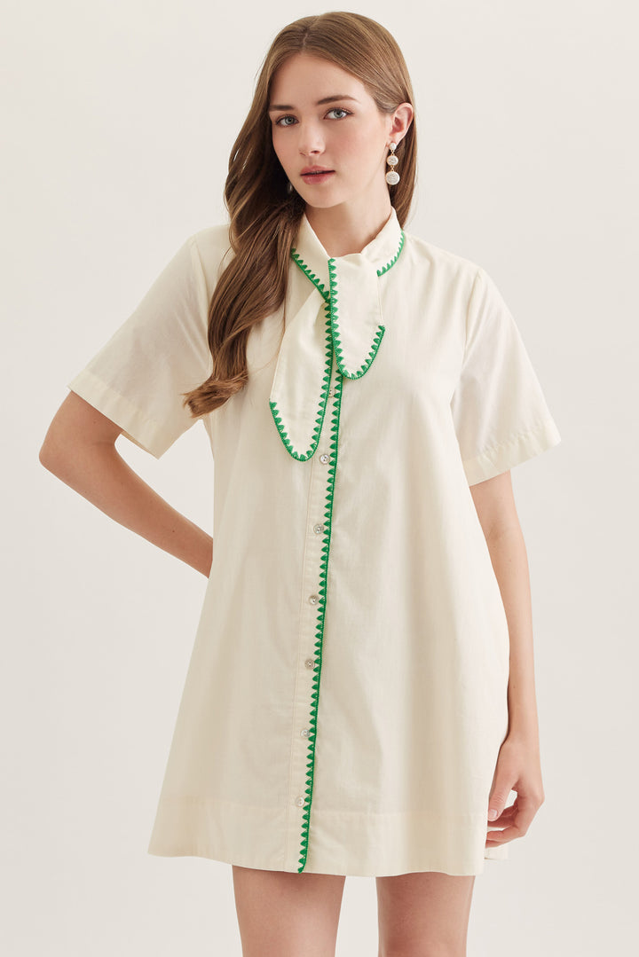 Ecru mini dress with green trim and button front