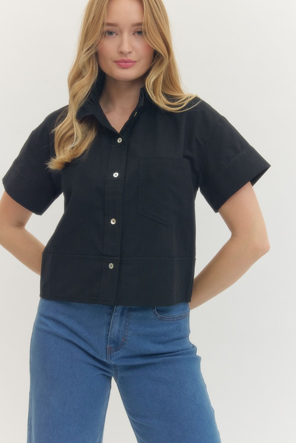 Black button front top with ruffle collar at Hailos boutique in Decatur Alabama