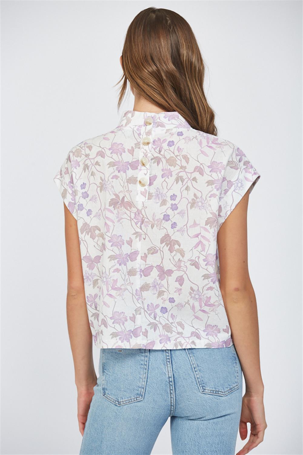 Lavender floral sleeveless blouse with high neckline and back button detail at Hailos boutique in Decatur Alabama