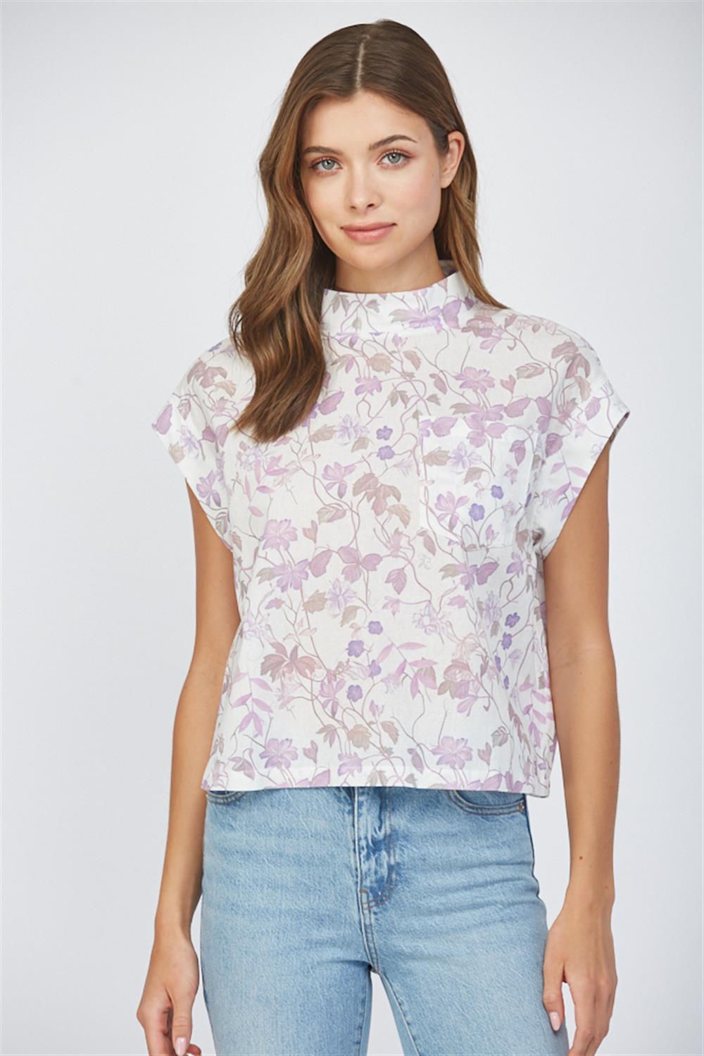 Lavender floral sleeveless blouse with high neckline and back button detail at Hailos boutique in Decatur Alabama